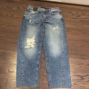 BNWT Own. Twist leg mom jeans